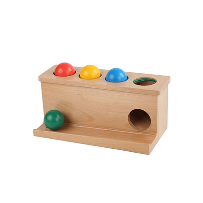 Caja con pelotas de colores para empujar (hogar)